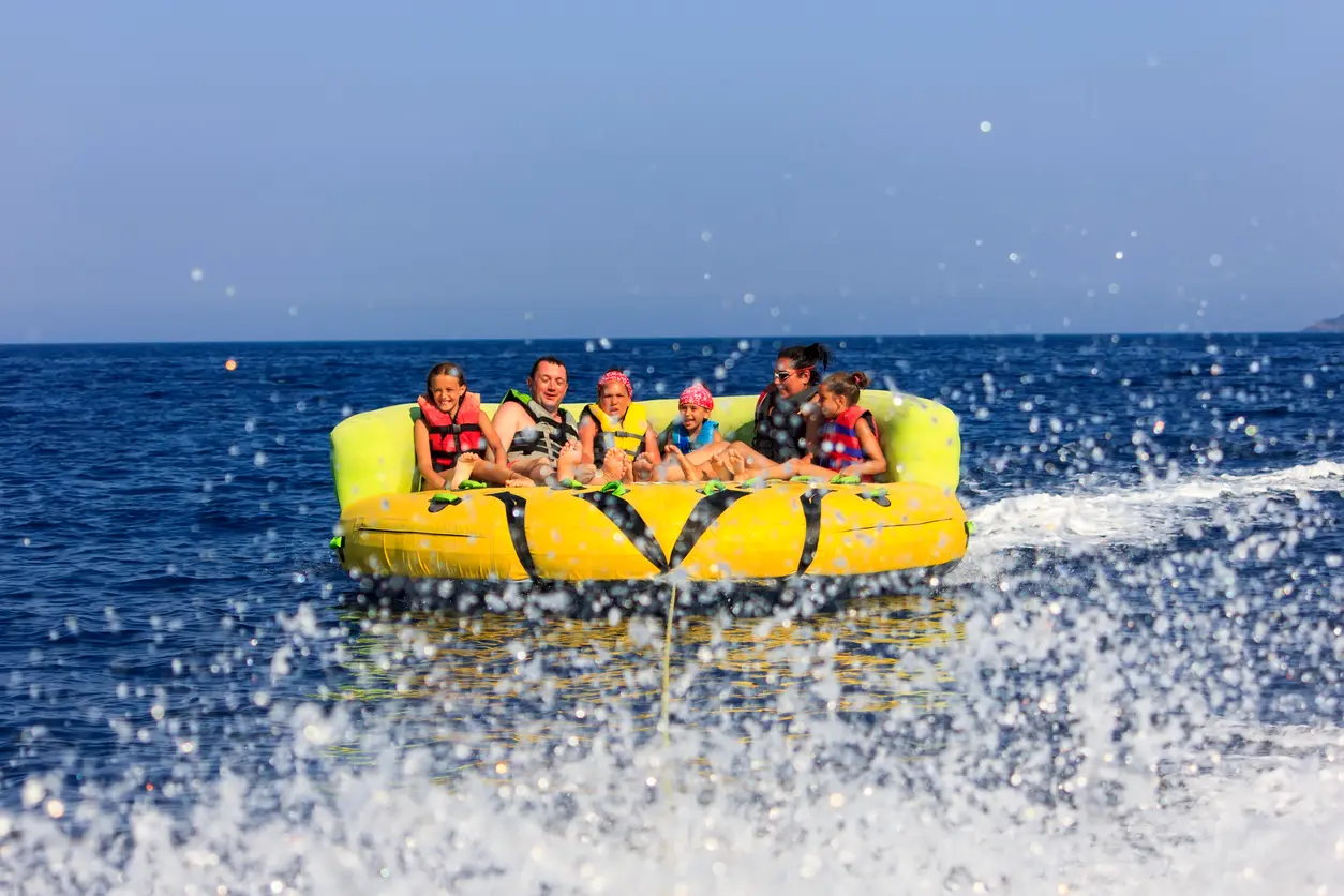 Family enjoying a crazy sofa boat ride in Sharm el-Sheikh