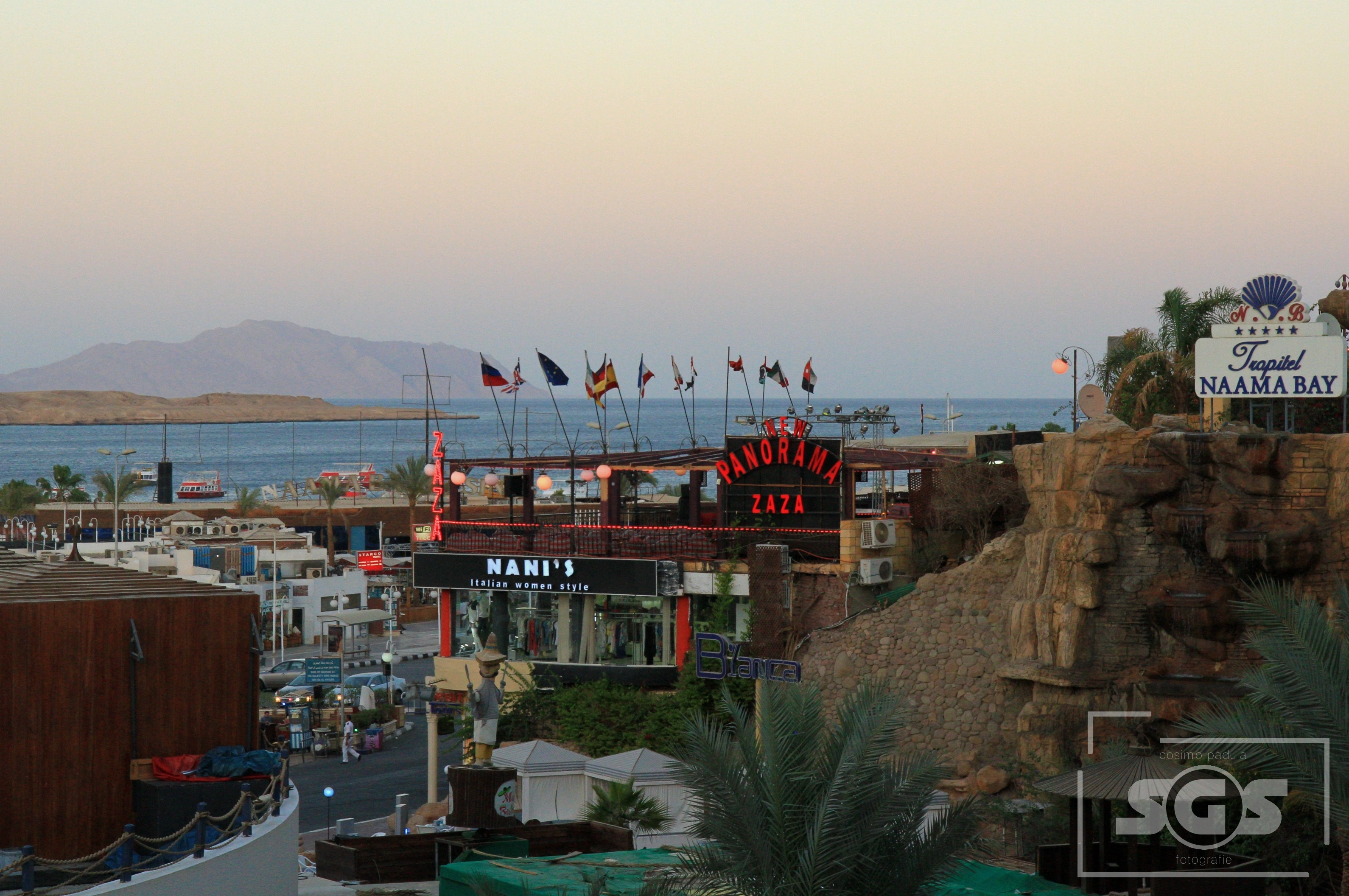 Beautiful day view of the beach and palm trees in Naama Bay, Sharm El Sheikh